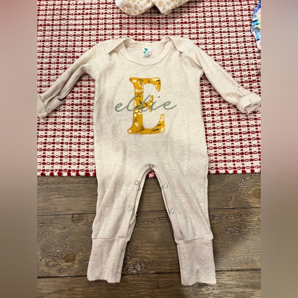 Baby girl, one piece with embroidered “Ellie”. Size 3-6 month. Great condition.